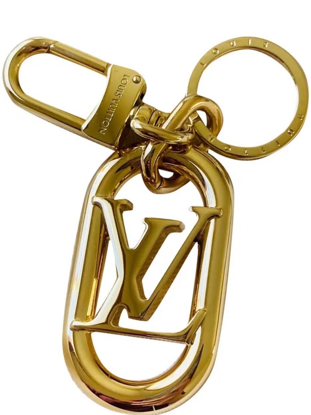 Louis Vuitton plated in 18K karat gold. LV Logo Key Ring Charm